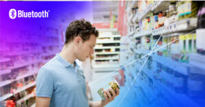 Young man examines food jar in vibrant grocery aisle, blending traditional shopping with technology.