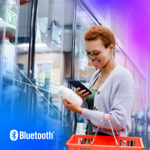 Young woman joyfully shops in a modern grocery store with colorful products around her.