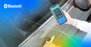 An overhead view of a person with one hand on a car door, showing a smartphone in the other hand unlocking the car door using a Bluetooth Channel Sounding enabled digital key.